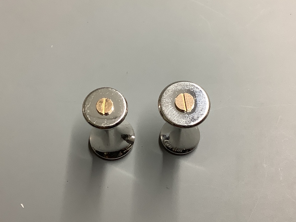 A modern pair of Cartier 925 and yellow metal cufflinks, modelled as a pair of dumbbells, 23 mm.